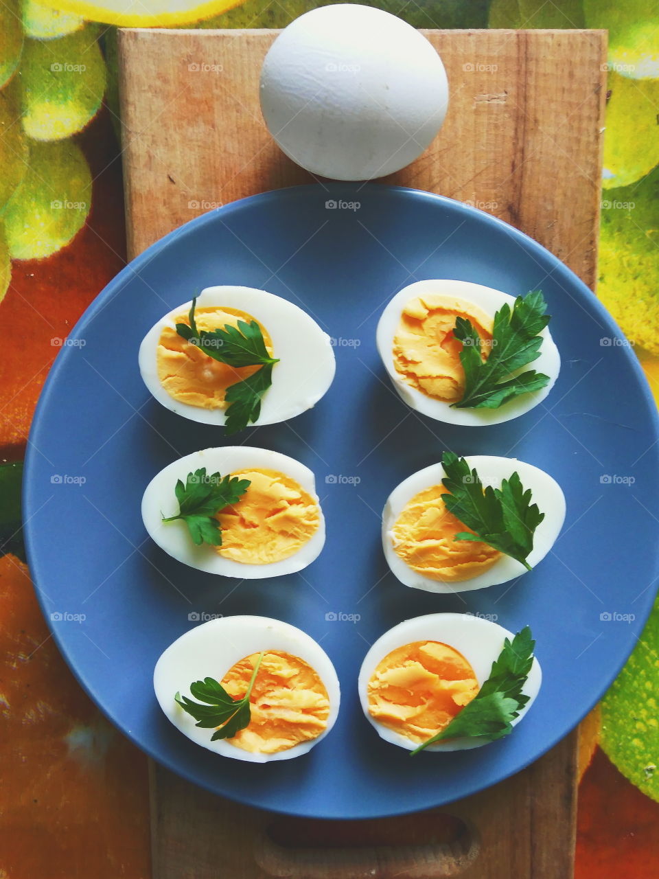 cut boiled eggs decorated with parsley