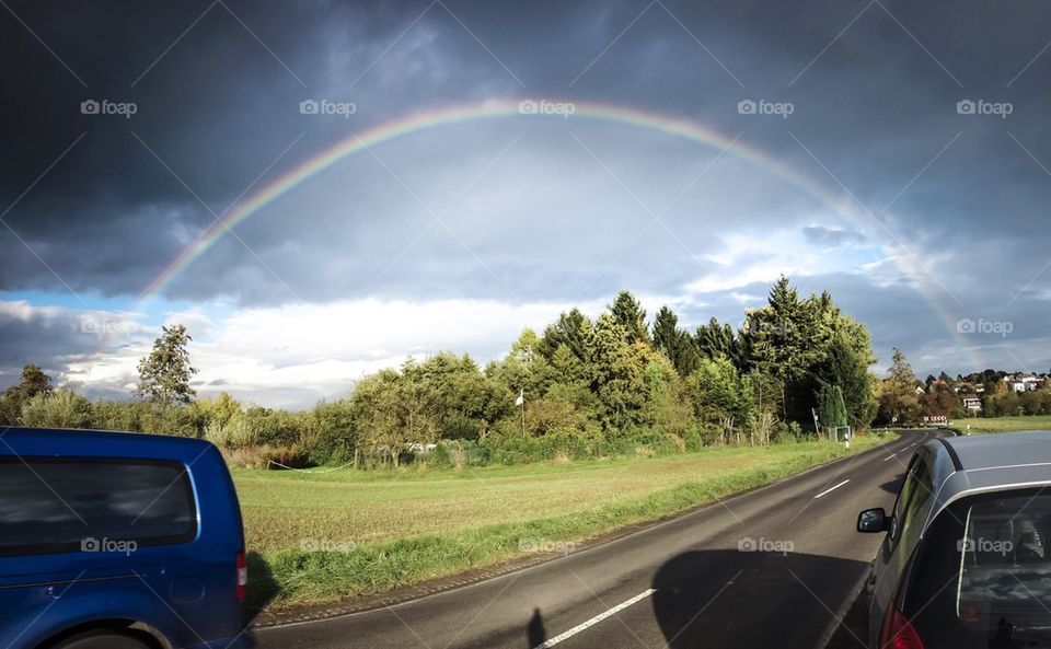 Rainbow fields in Germany on a cloudy sunset