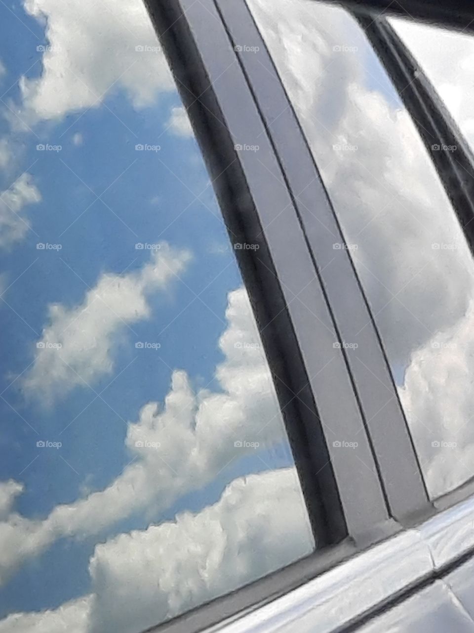 clouds and sky in car windows