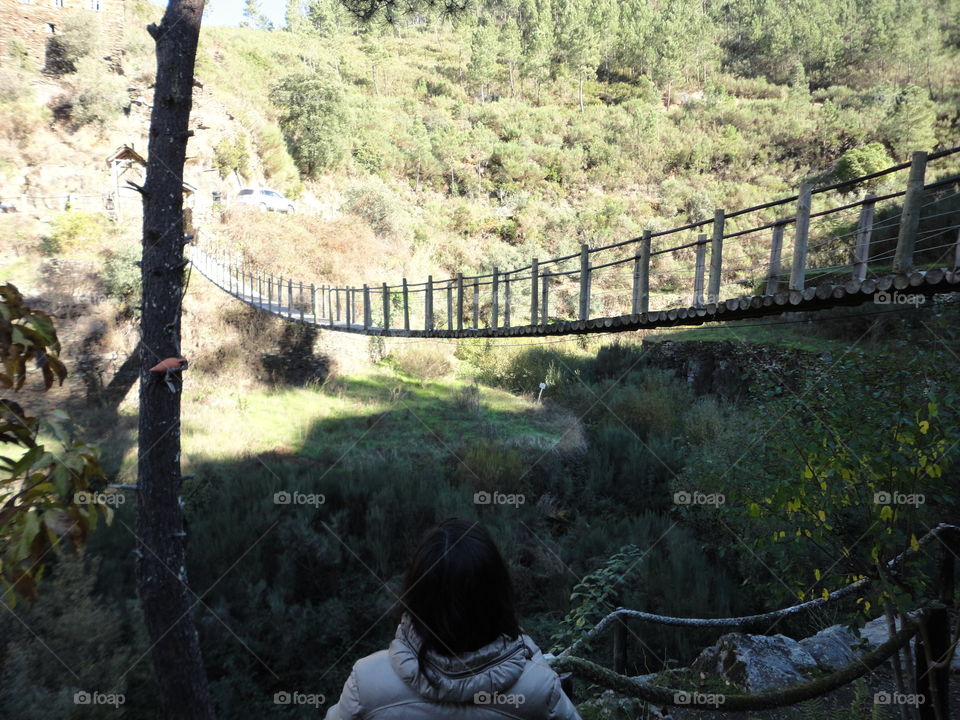 wooden suspension bridge and girl looking