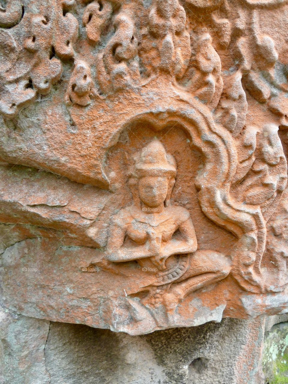 A deity inscribed into stone at Angkor Wat