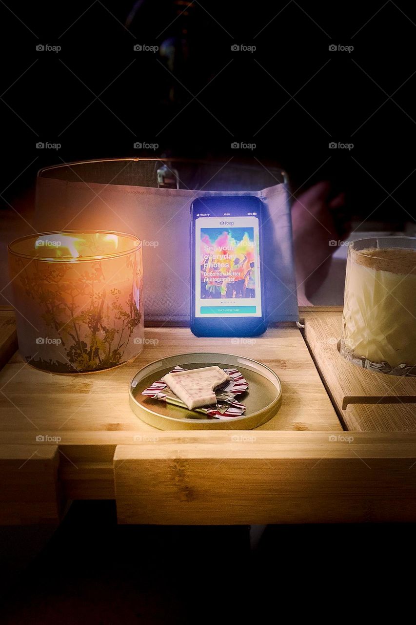 Working on Foap photo ranking from my bathtub desktop. Candlelight, eggnog and peppermint chocolate make this kind of work pretty pleasant.