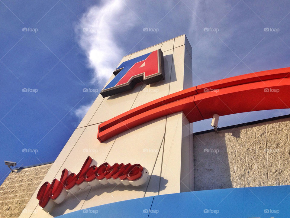 Welcome neon sign in gas station