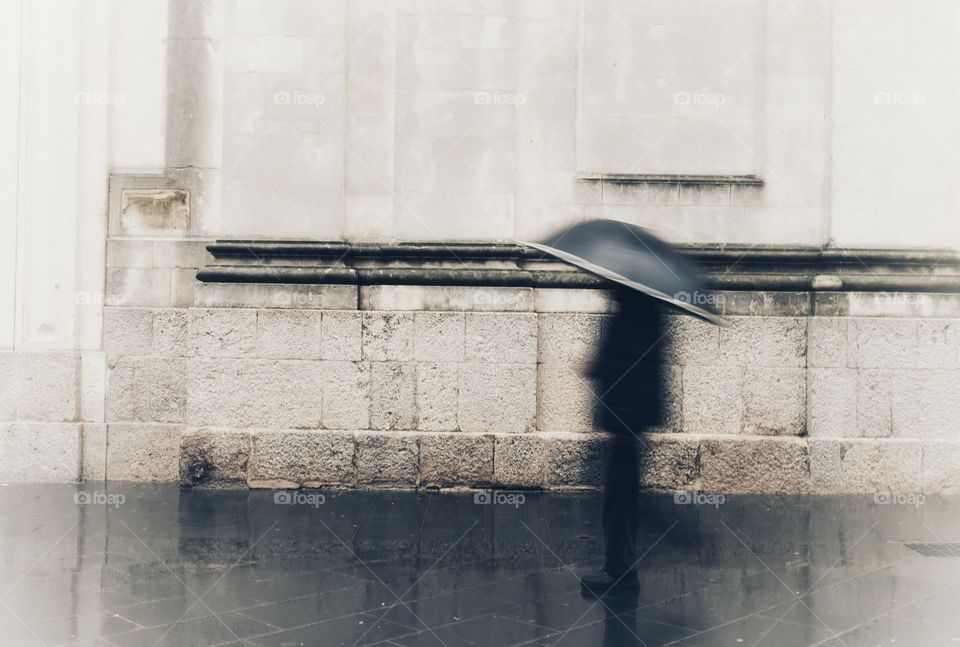 In the rain with an umbrella