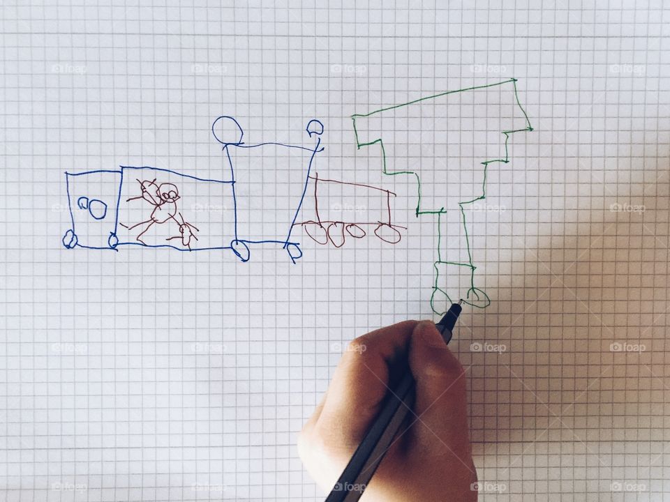 Childrens drawing on paper. Child drawing with pen on paper