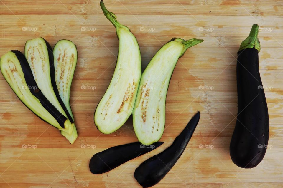 Whole and slice Eggplant . Whole and slice Eggplant on the counter 