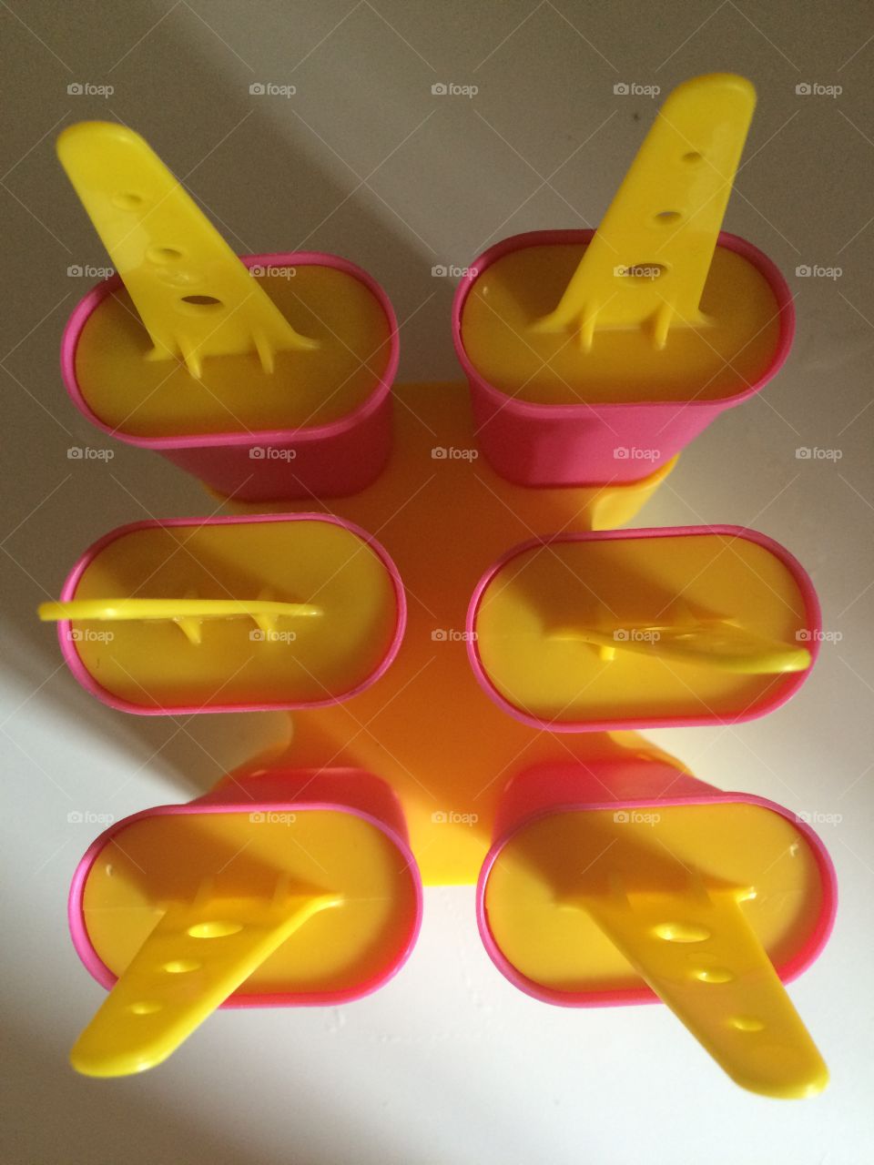 Pink Ice cream maker on white background