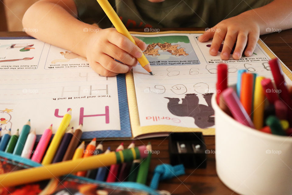 Child practicing to write