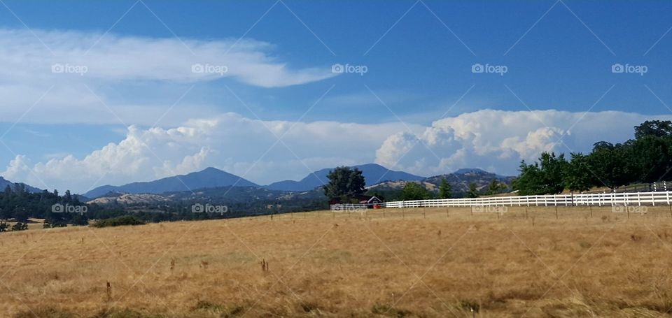 leaving my home to visit family. clouds were beautiful. this picture taken on hwy 299 east of Redding, Ca a few days before a major fire. in the area.