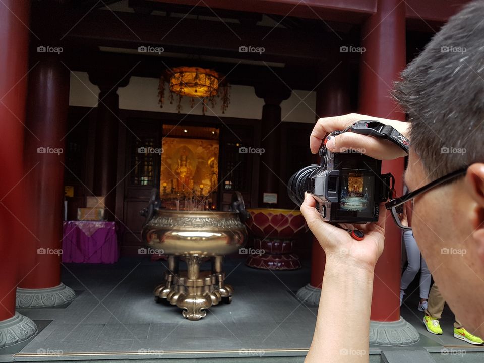 photographer taking picture at a temple