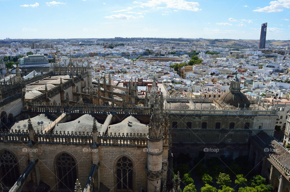 View of Sevilla cathedral and city from Giralda tower