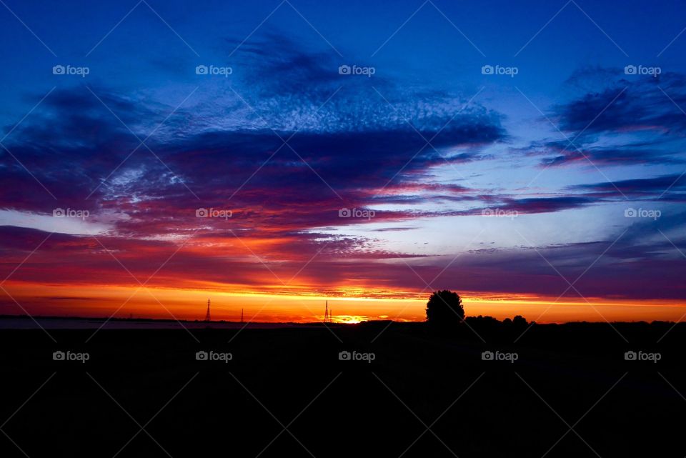  beautiful sky colors just before the sun goes down completely at nature dike in schleswig holstein germany