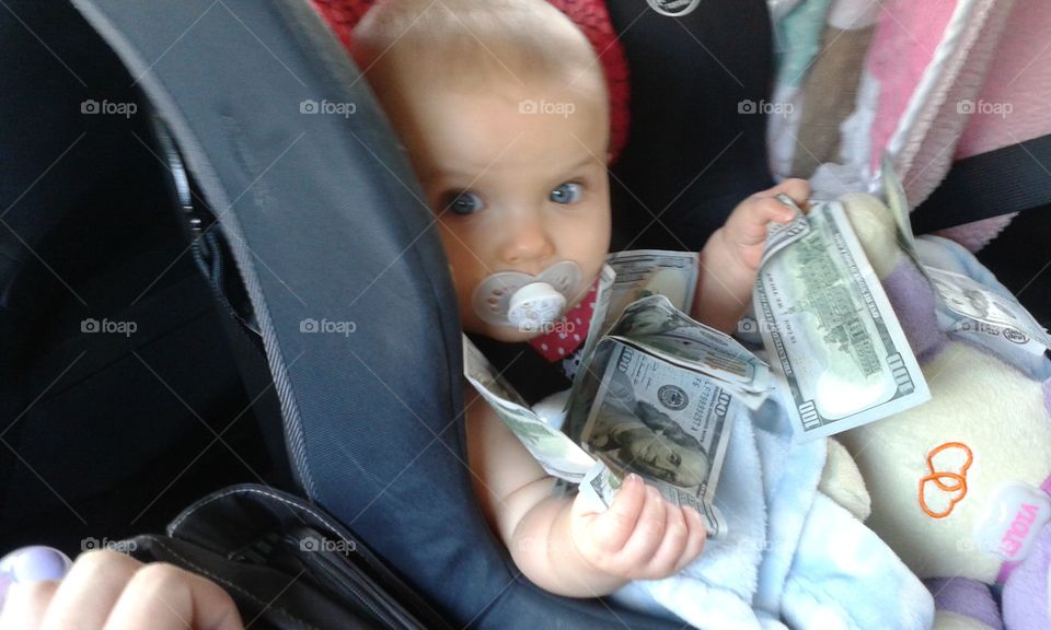 Rich Baby. Money for a trip.