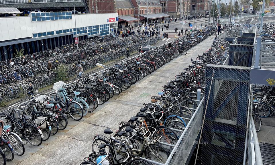 Bike lanes, bike parking and people on their bikes in Amsterdam