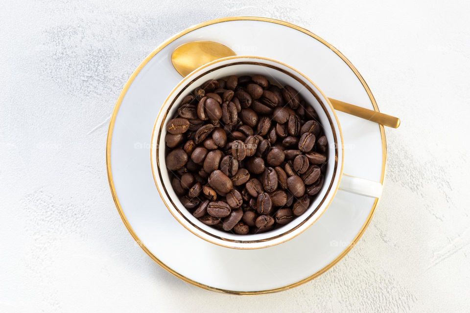 coffee beans in a porcelain cup