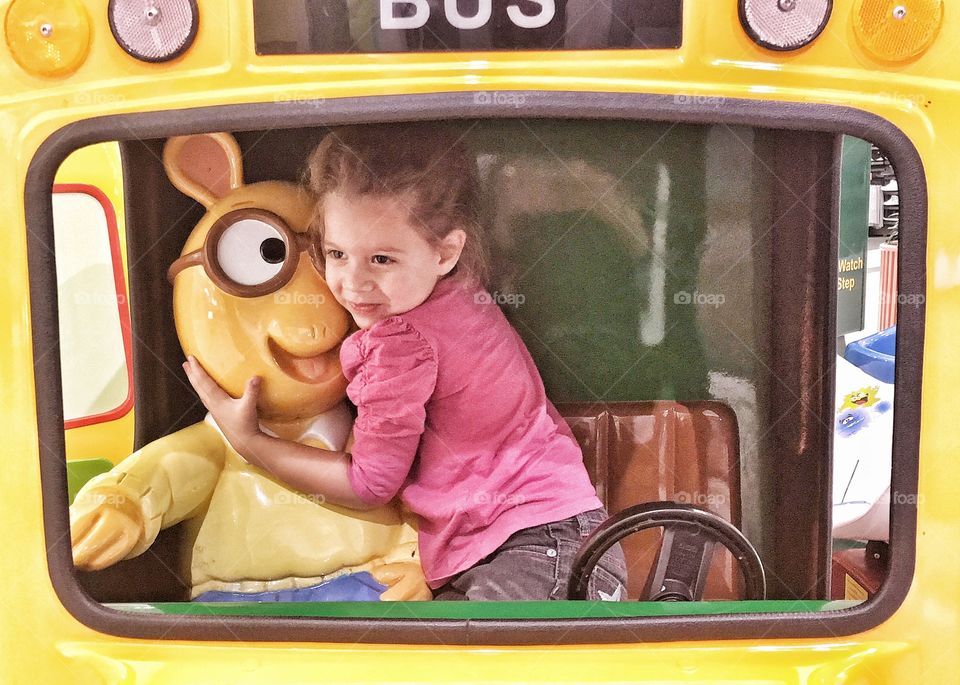 Cute girl playing in bus