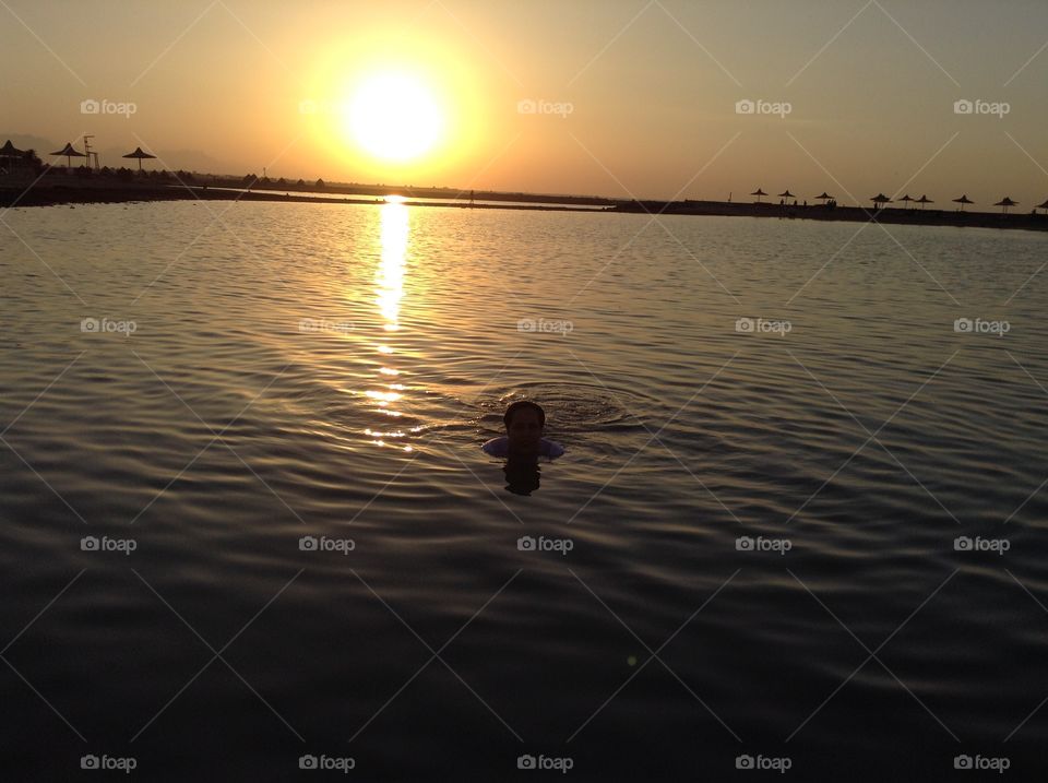 Swimming in the Red Sea before the sunset