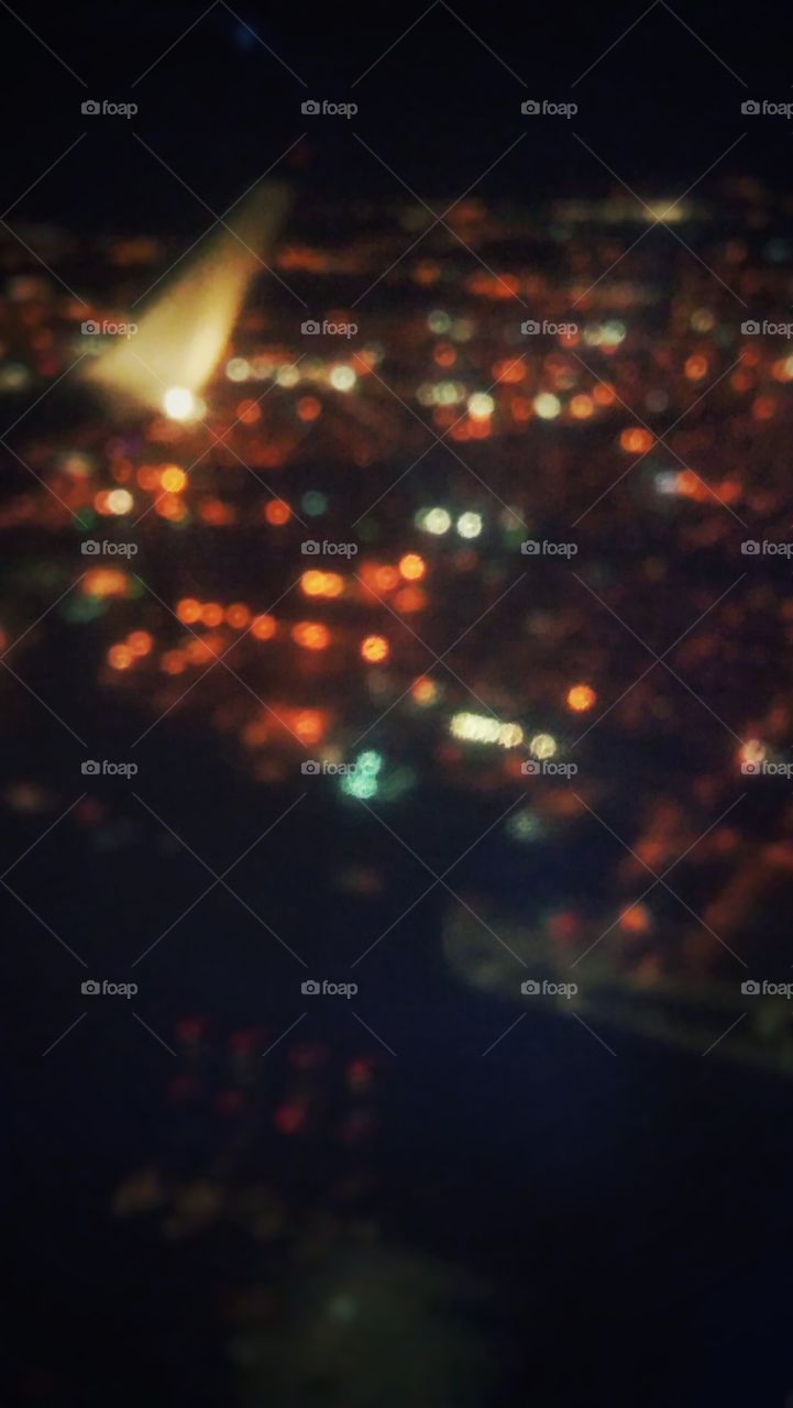Blurry city lights from a plane