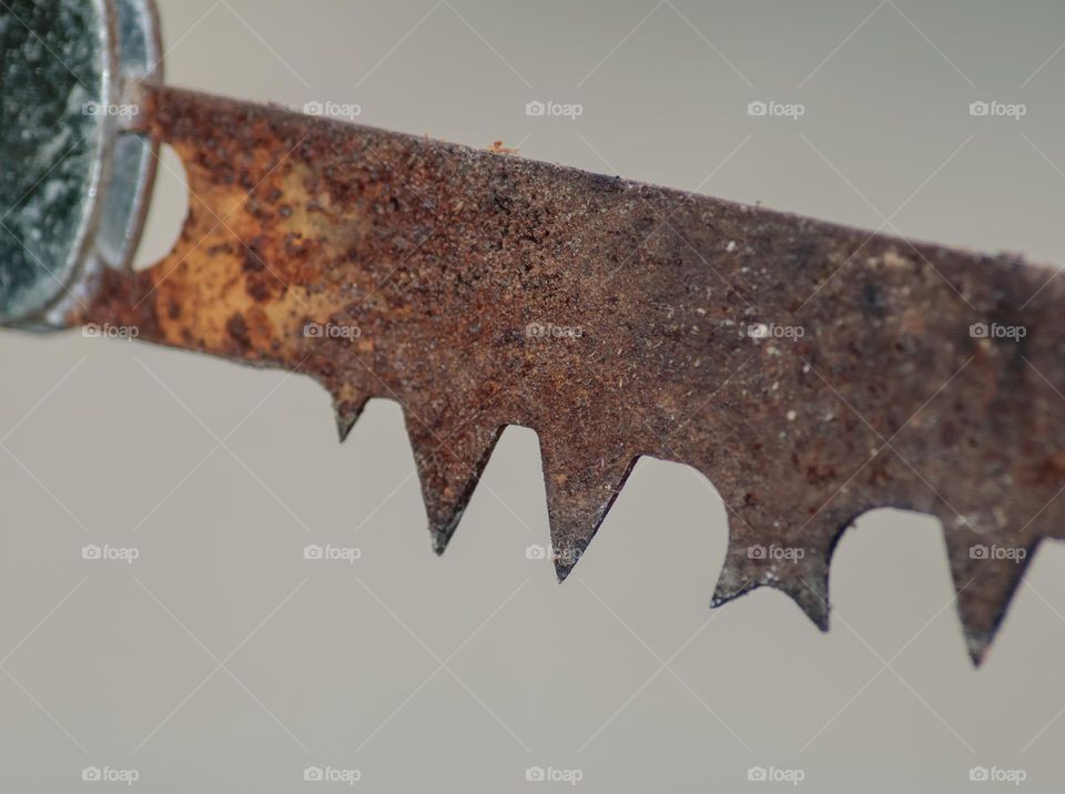 Triangular points on an old rusty saw