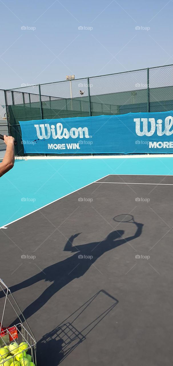 My shadow playing tennis