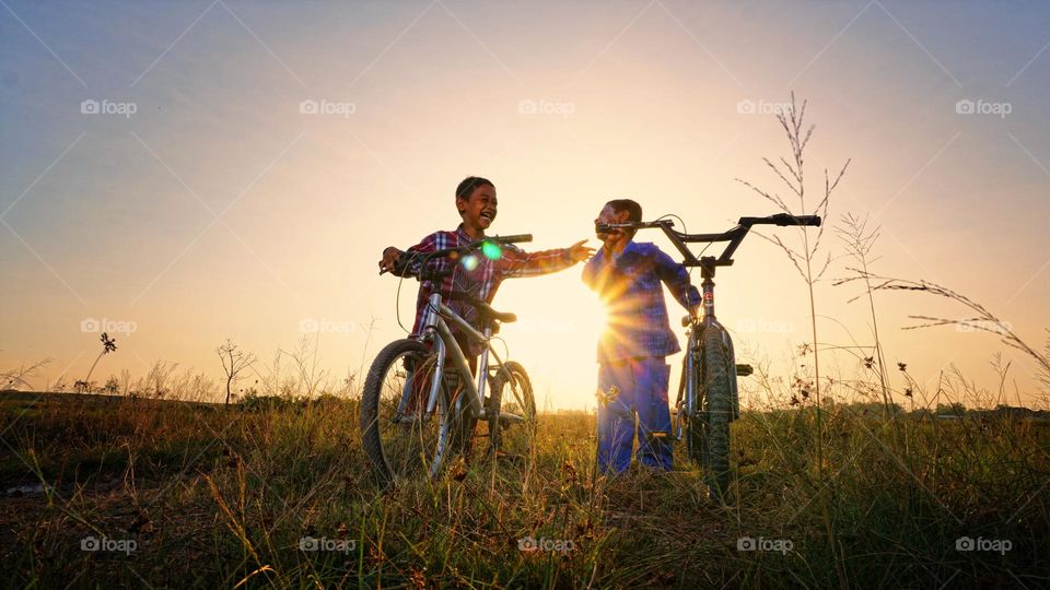 the happiness of the two children who were cycling in the afternoon