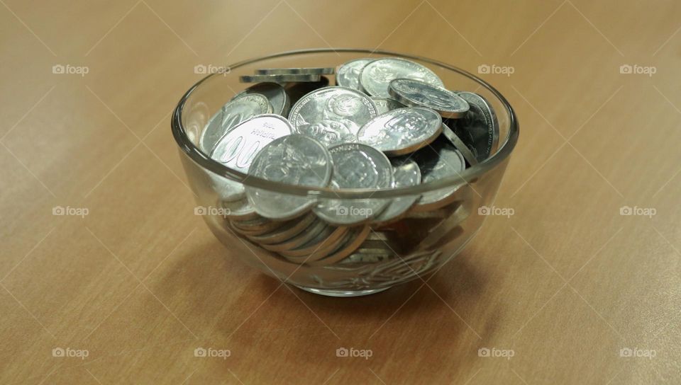 Photo of a pile of coins in a bowl