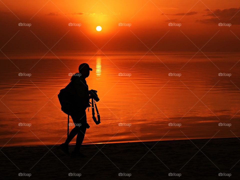 My Top Summer Snaps - A young lady walks along the sandy beach hoping to catch the magnificent sunset