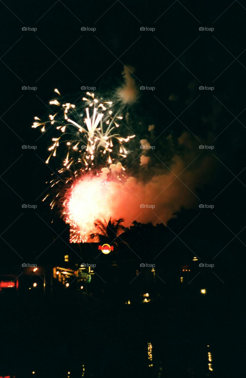 Firework display at Bay Front, Miami, Florida as seen from boat on Biscayne Bay