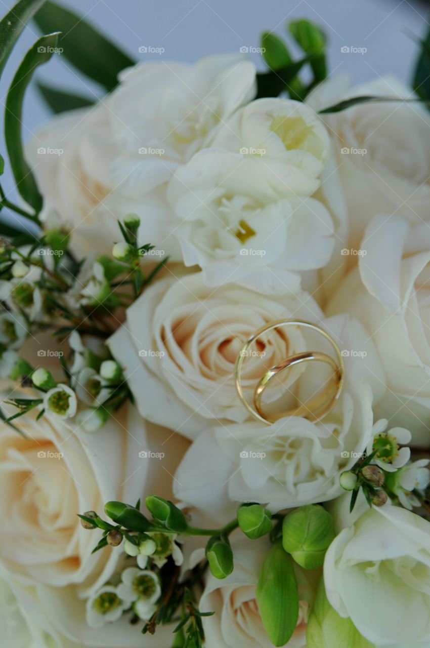 Wedding flowers. Wedding rings on flowers