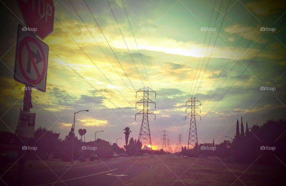 beautiful sunset over electricity towers