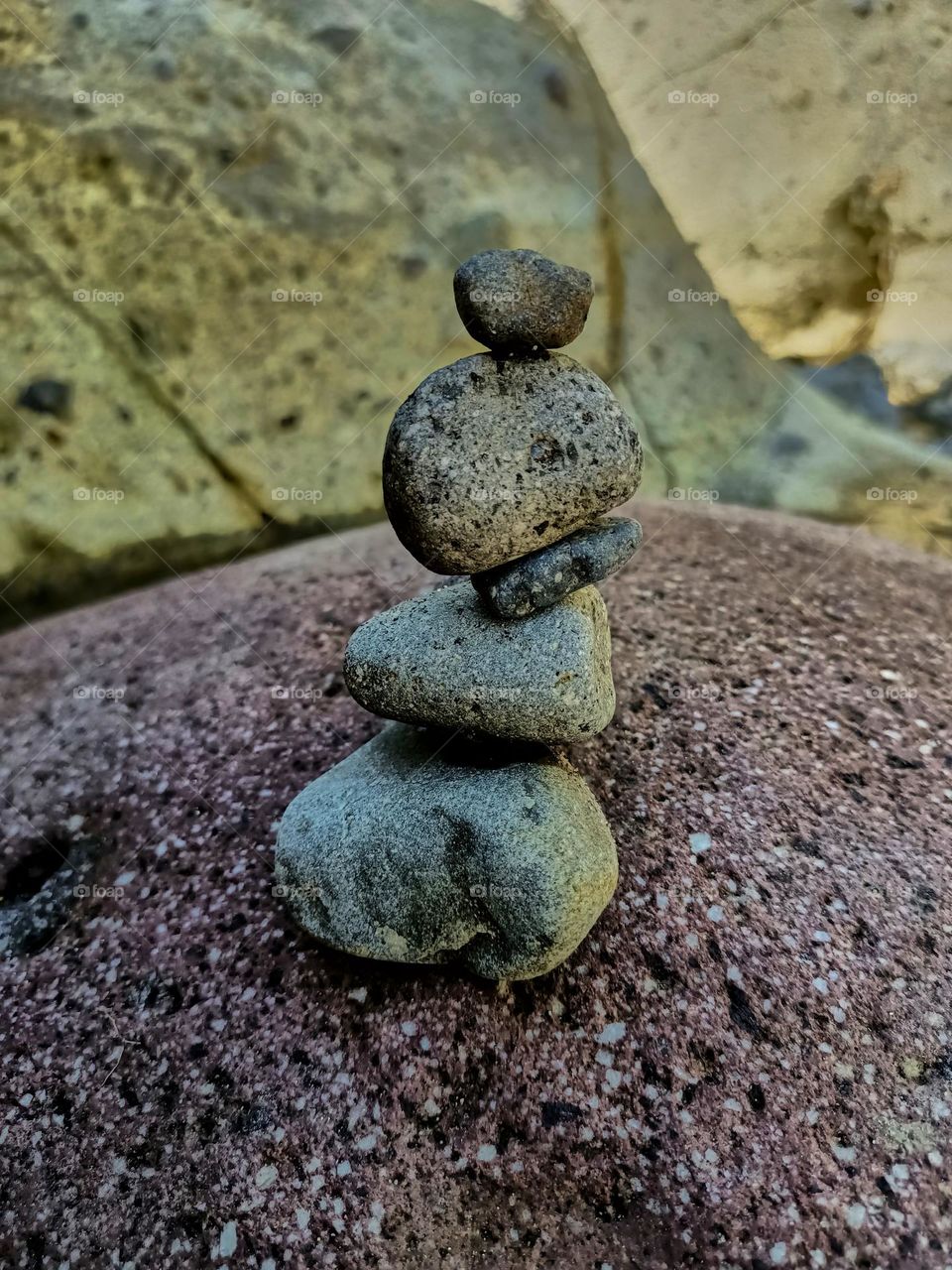 Stack of stones balancing on the river