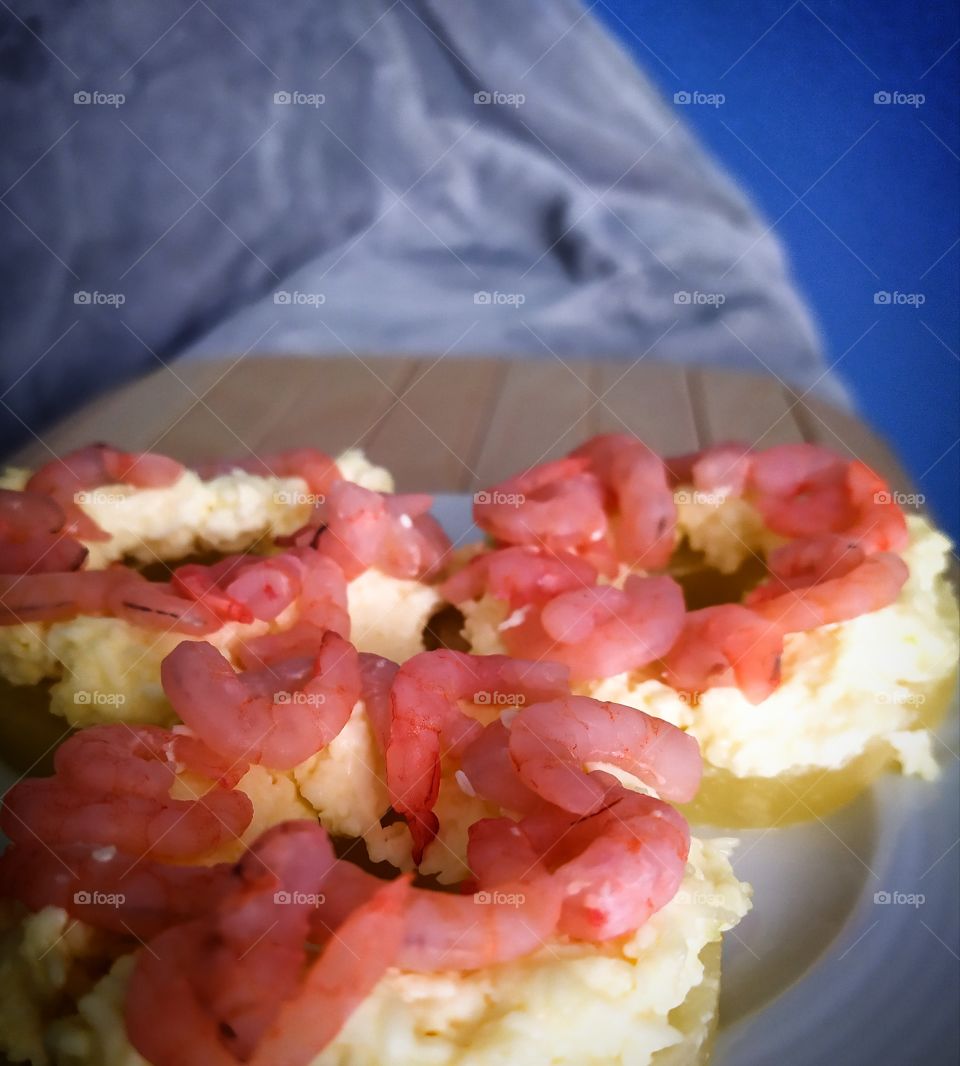 Snack.  Pineapple rings with grated cheese and shrimps
