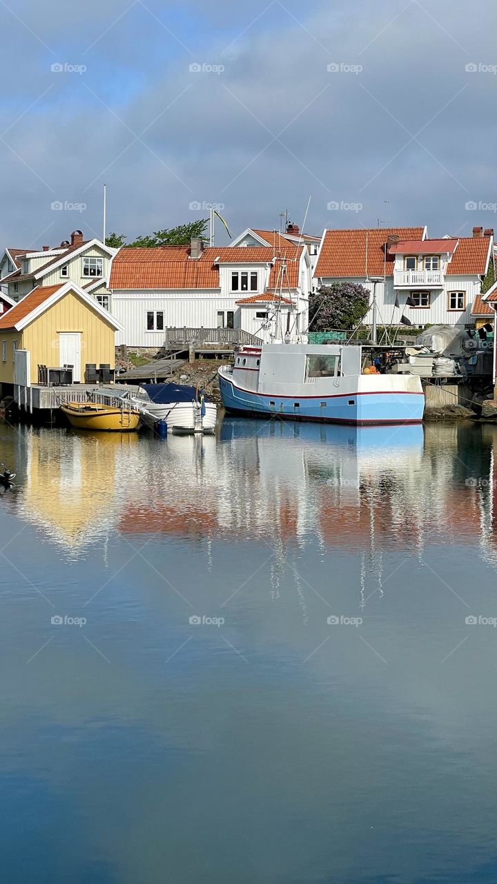 Small beautiful old little fishing village by the ocean on the Swedish west coast Bohuslan on a sunny day 