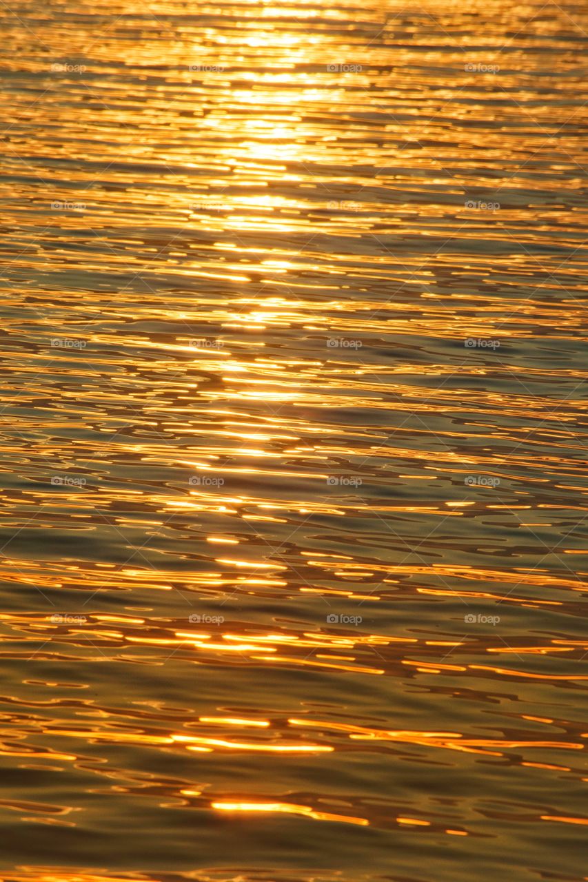 Reflection Texture light of sunset at water