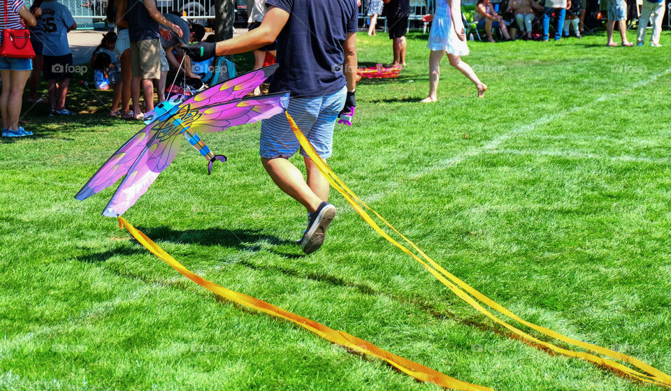 Man carrying beautiful kite