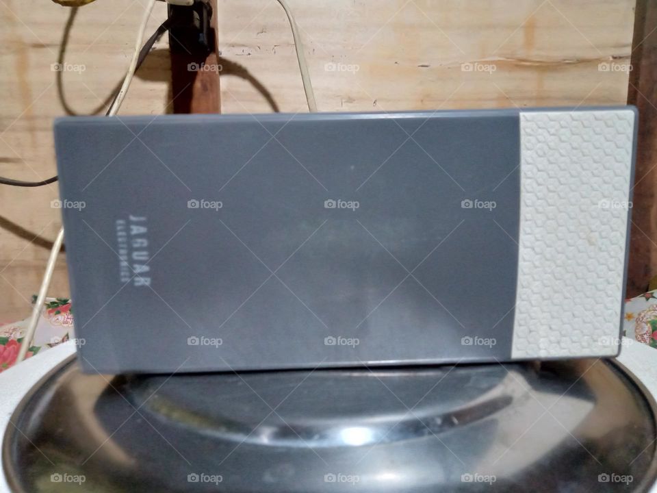 CHARGED POWERBANK IN WHITE AND GRAY COLOR