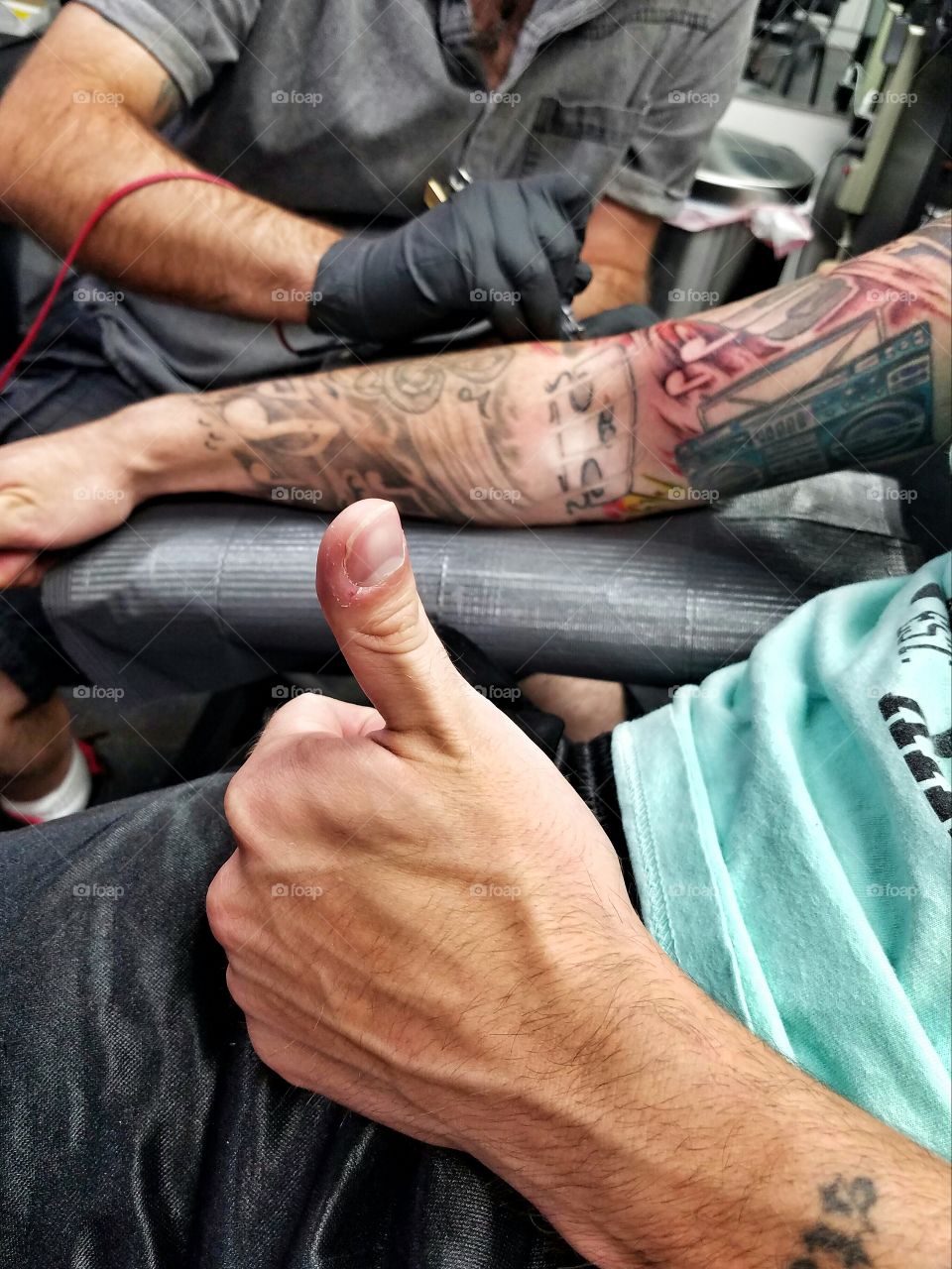 My best friend getting his tattoo sleeve finished.