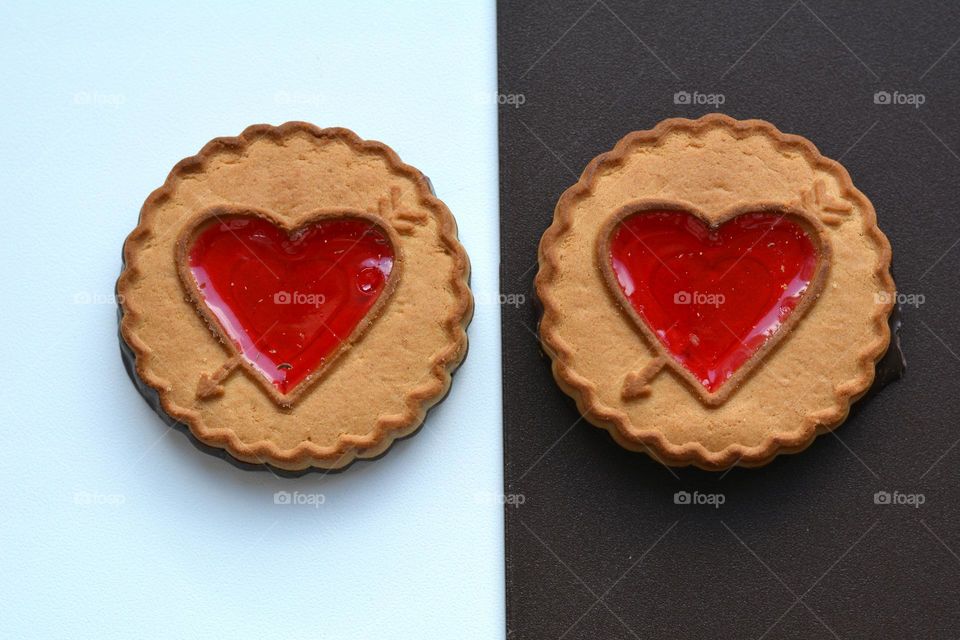 cookies hearts top view white and brown background