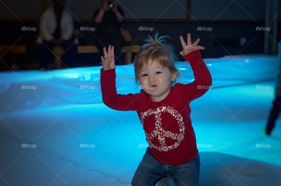 Little girl playing on inflatable bounce