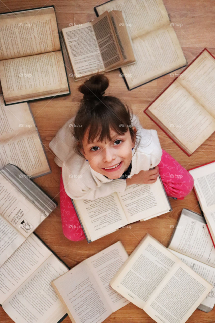 Little girl reading a book