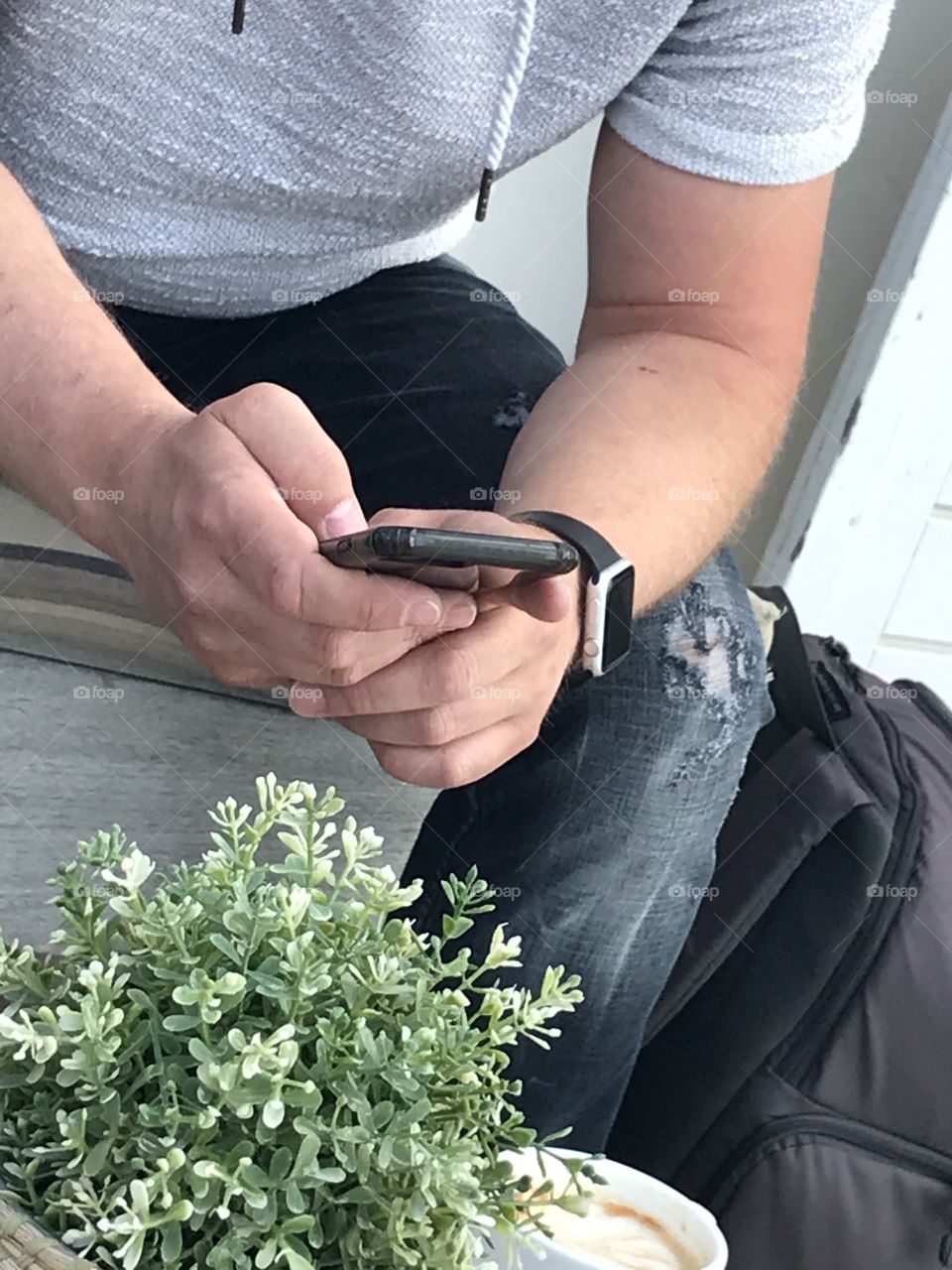 A man working on his phone