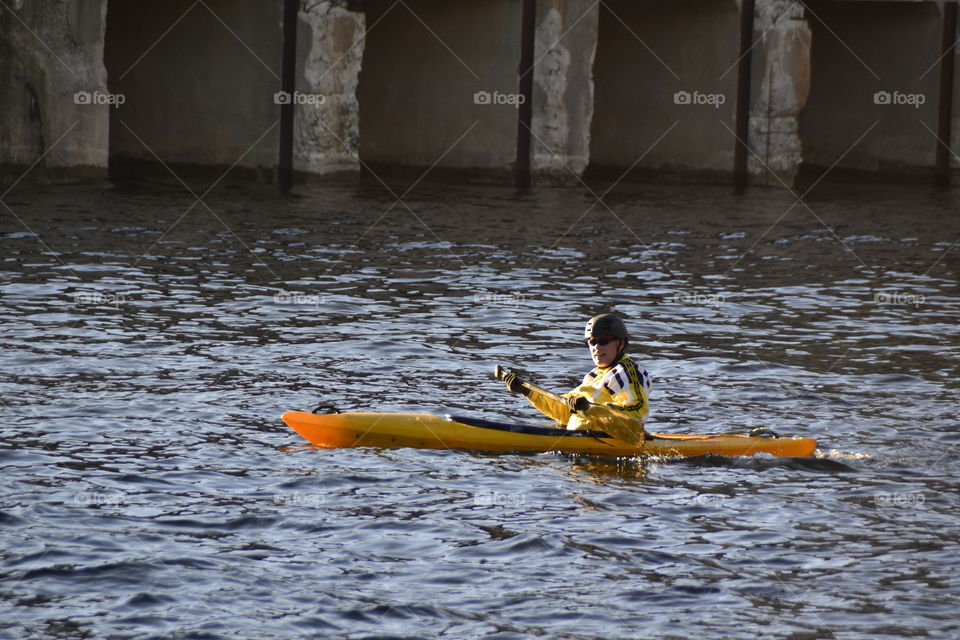 Man kayaking on river