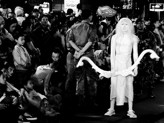 Participants in the cultural carnival parade look scary
