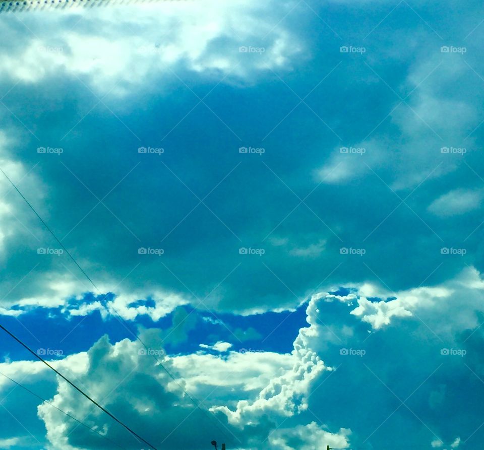 Blue sky with alit of clouds.