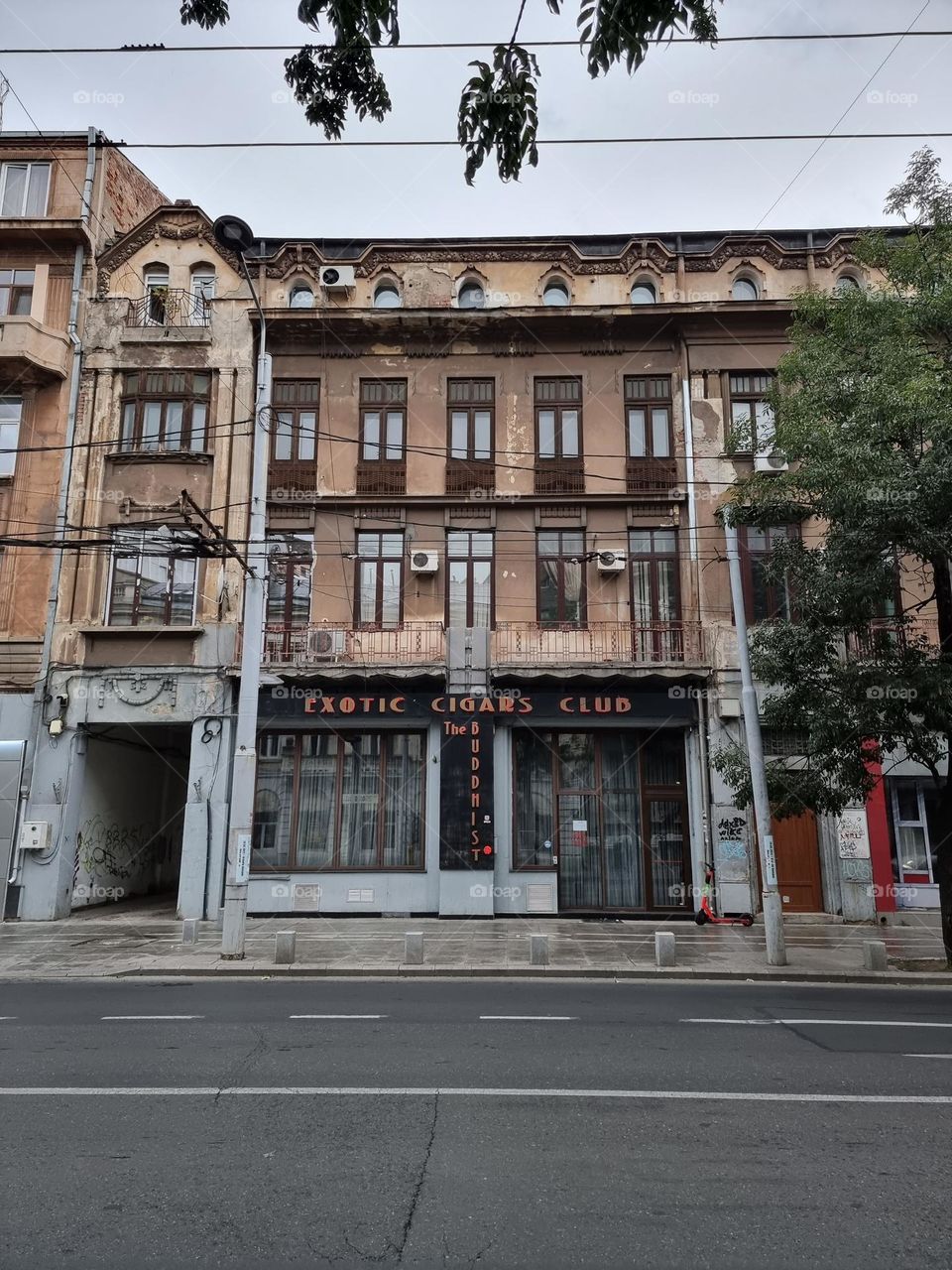 Facade of exotic cigars club in a historic building