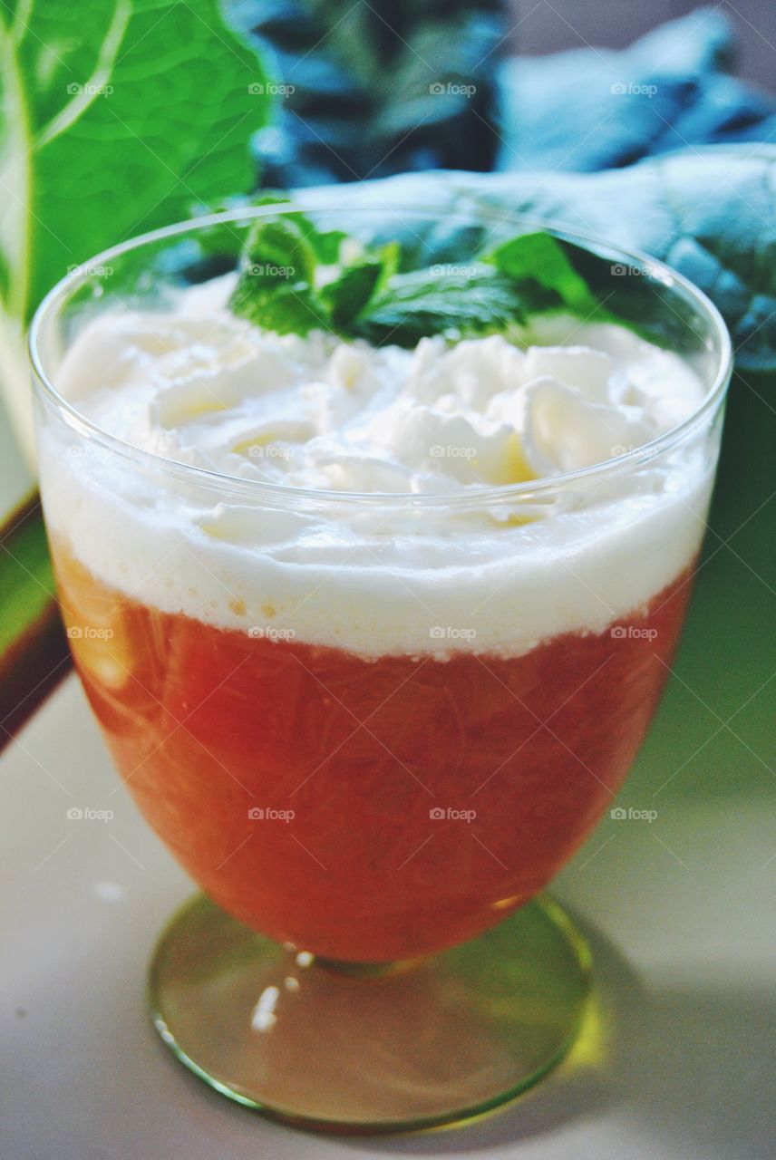 Rhubarb soup with whipped cream and lemon balm