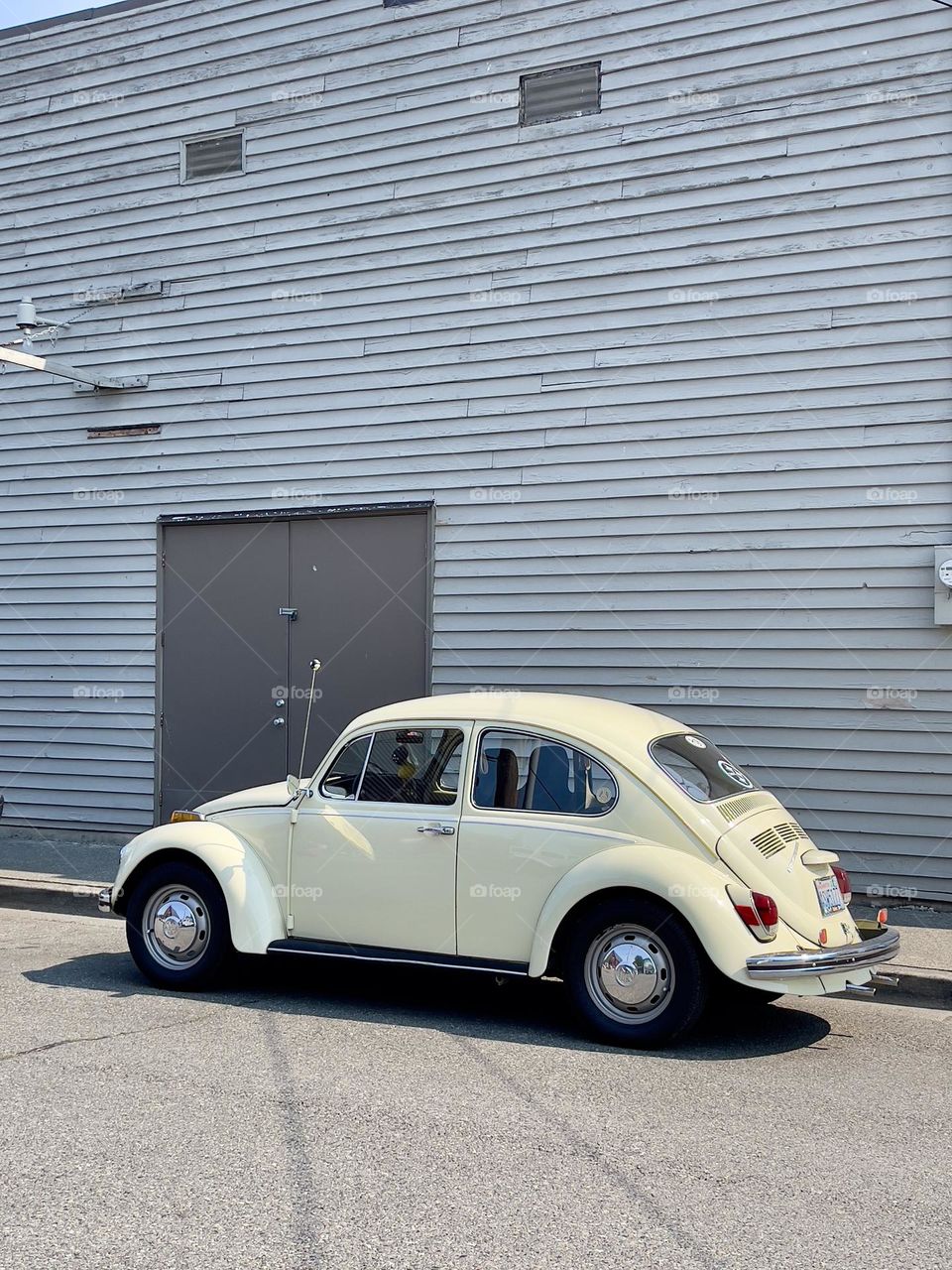 Beige retro car on the side of the road 