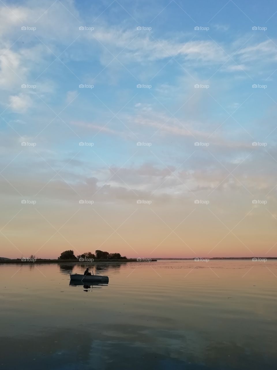 Autumn sunset. Landscape with a boat