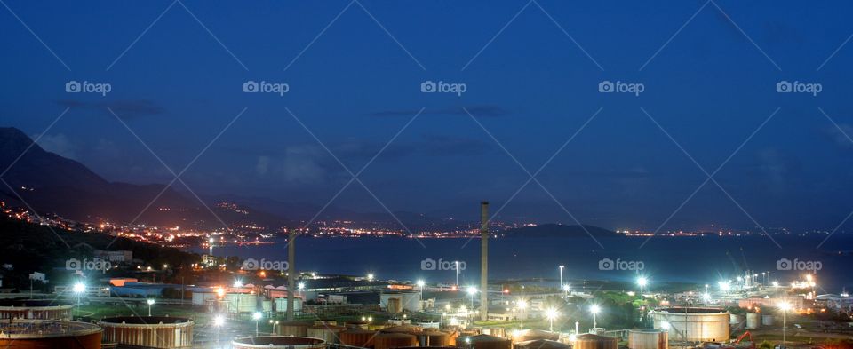 Oil industry on the coast, blue hour