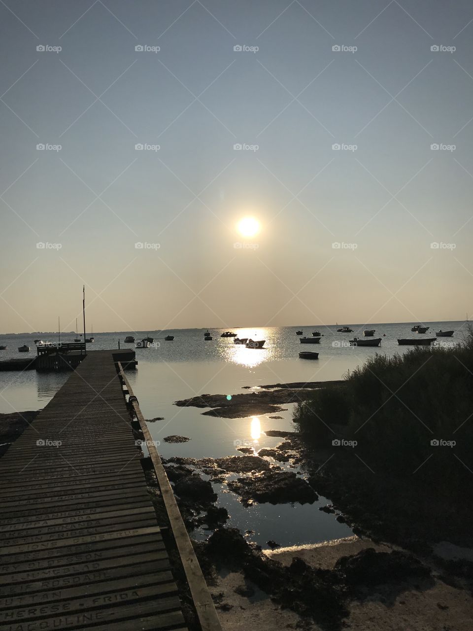 Sundown over the ocean from a harbour